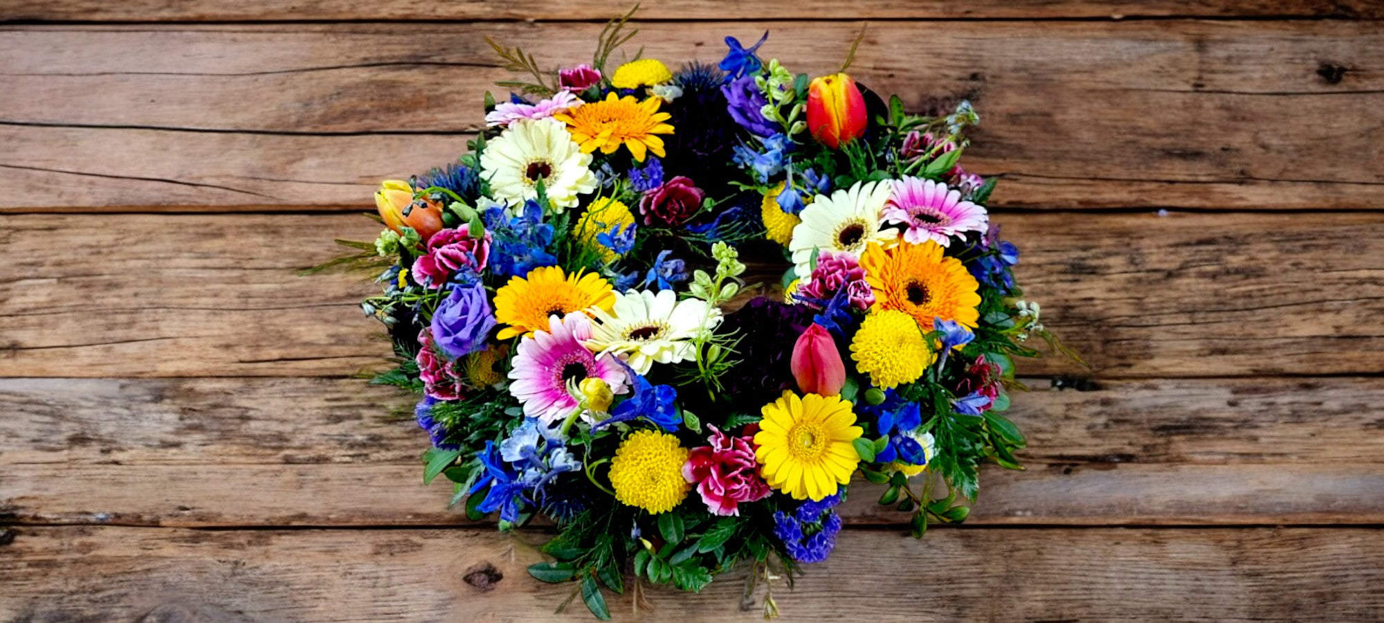 Multicoloured mixed flowers wreath - A Vibrant Celebration of Life