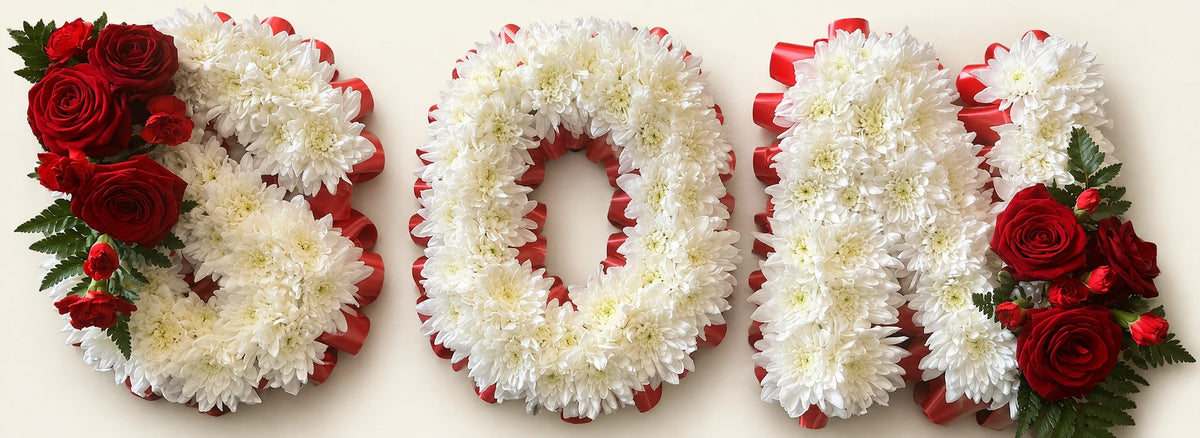 White chrysanthemum letters spelling SON with red edging and red rose corsages