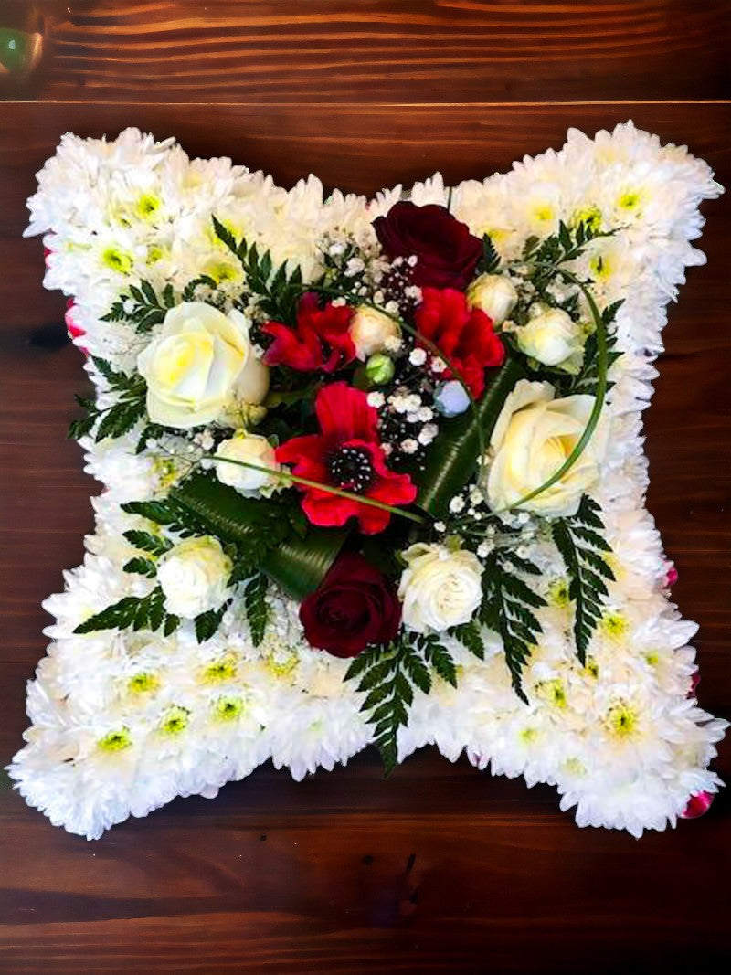 White Funeral Cushion with Flower Corsage in Centre