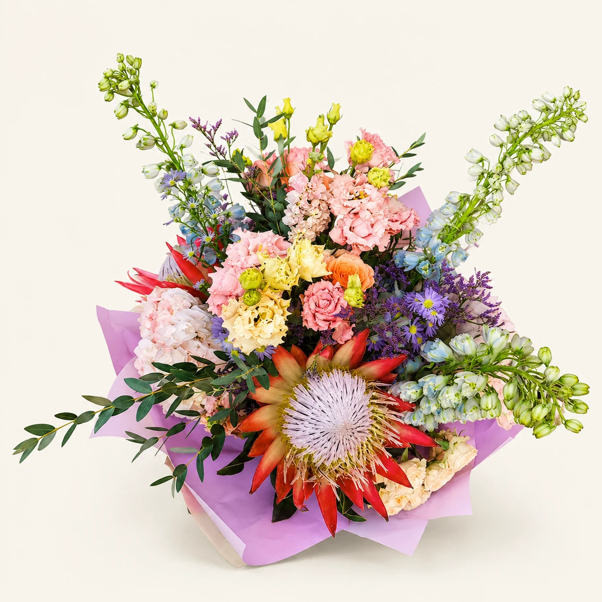 The Showstopper bouquet, front view, photographed on a soft cream background