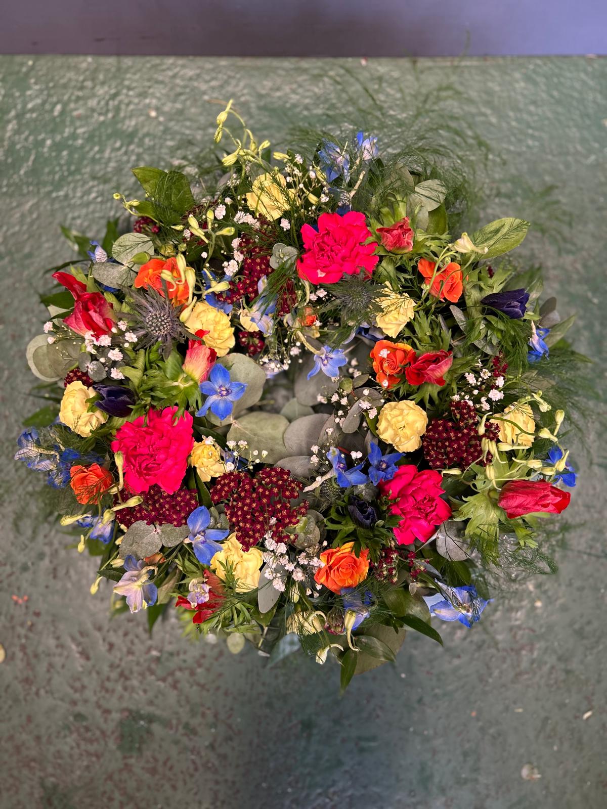 Multicoloured mixed flowers wreath - A Vibrant Celebration of Life