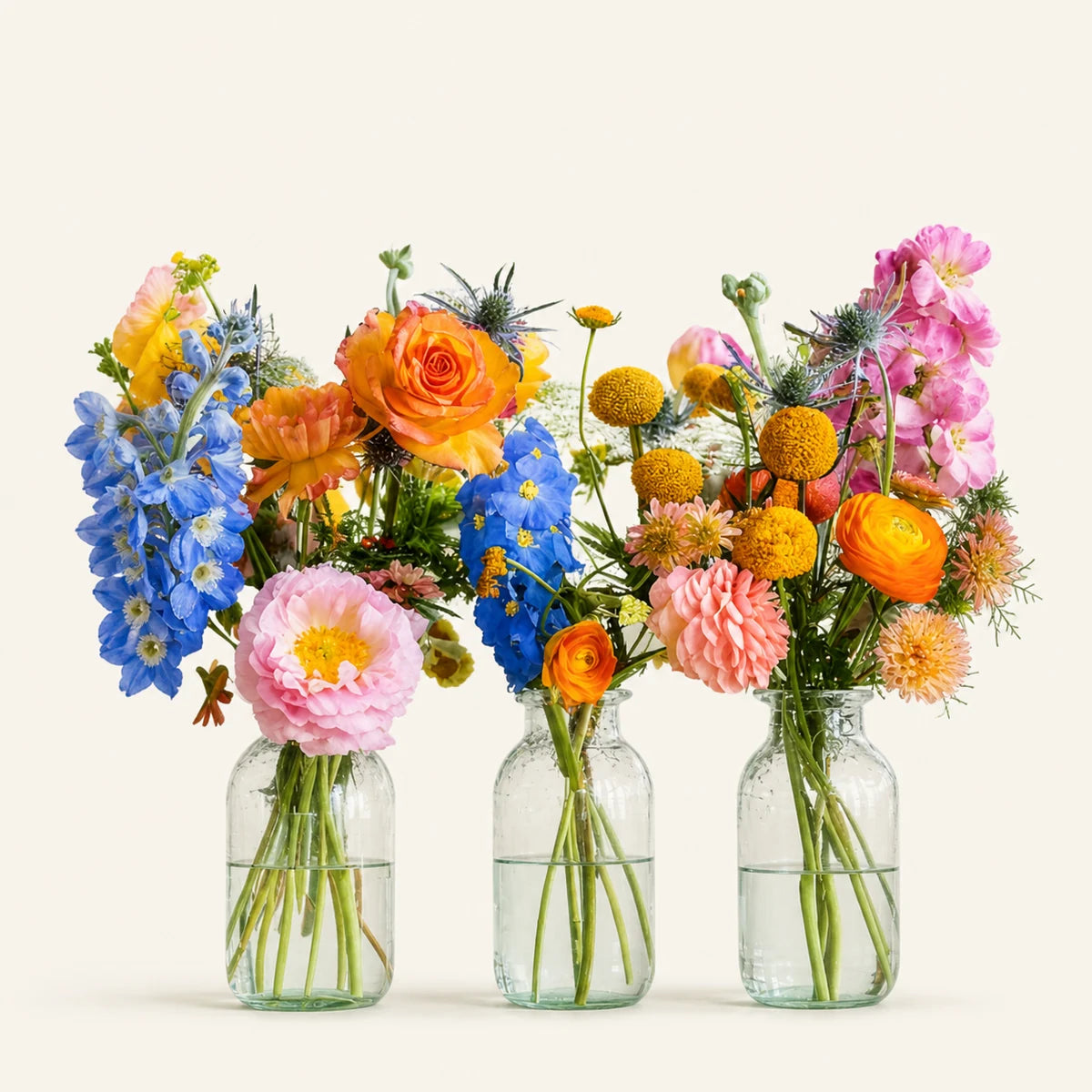 Bud Glasses, a handcrafted bud-vase arrangement by Lotty's Flowers