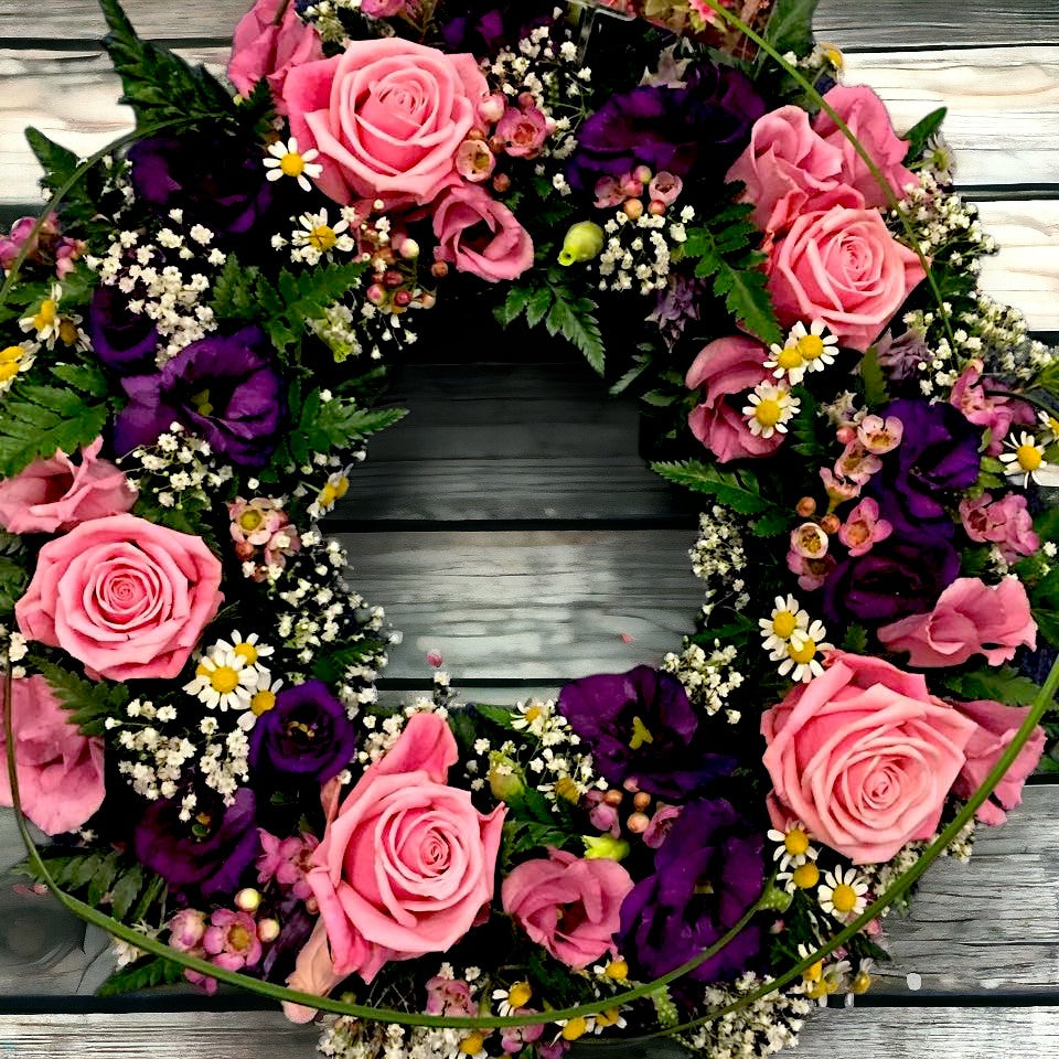 pink sympathy wreath with purple