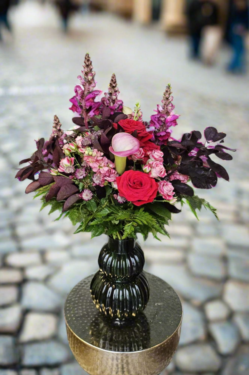 Pink and red premium vase arrangement with roses, calla lily, snapdragons and dark foliage