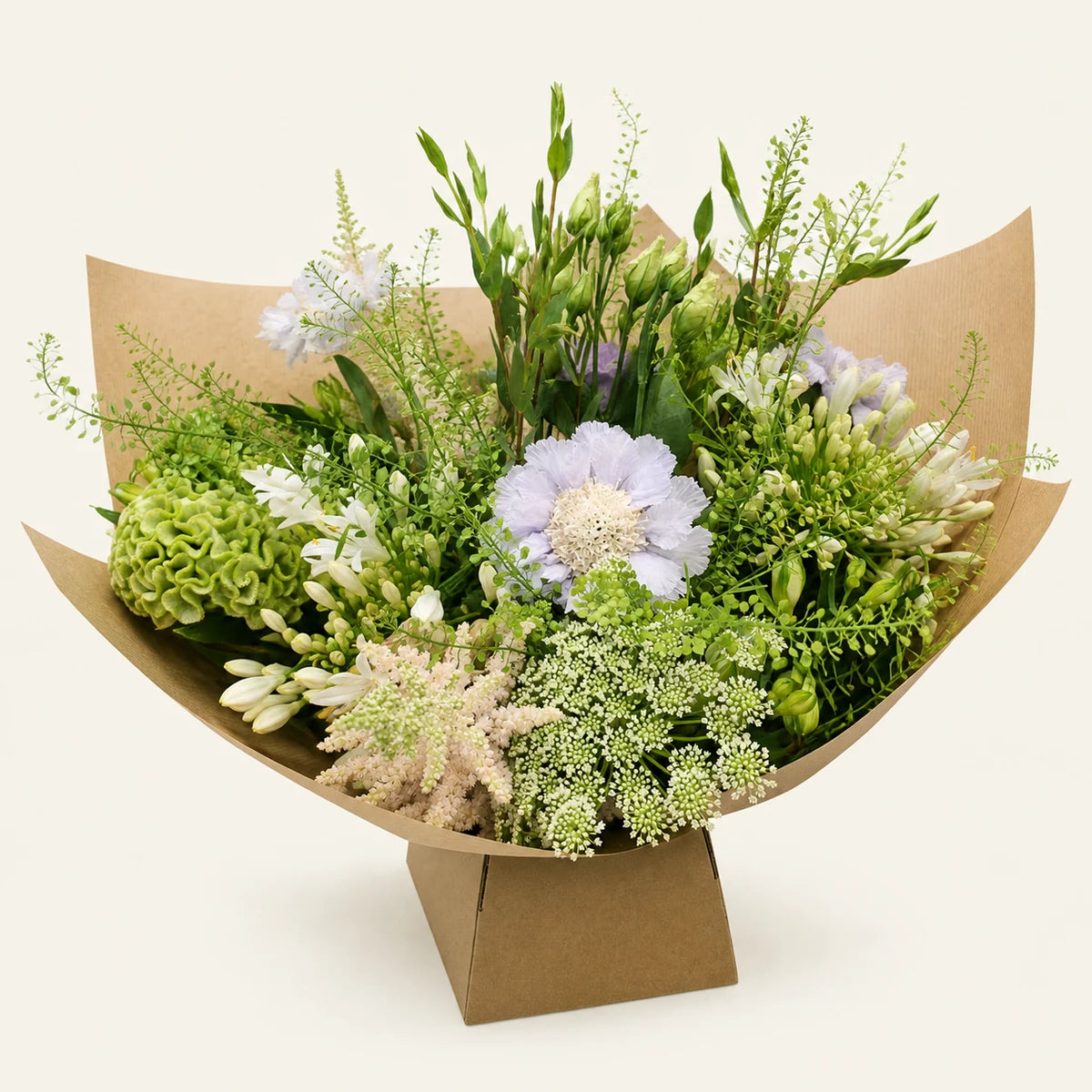 The Amelia bouquet, close-up, photographed on a soft cream background