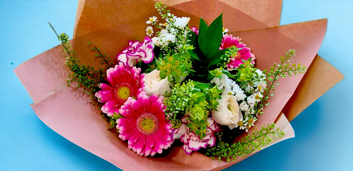 The Penelope bouquet with pink gerberas, carnations, white daisies and green foliage