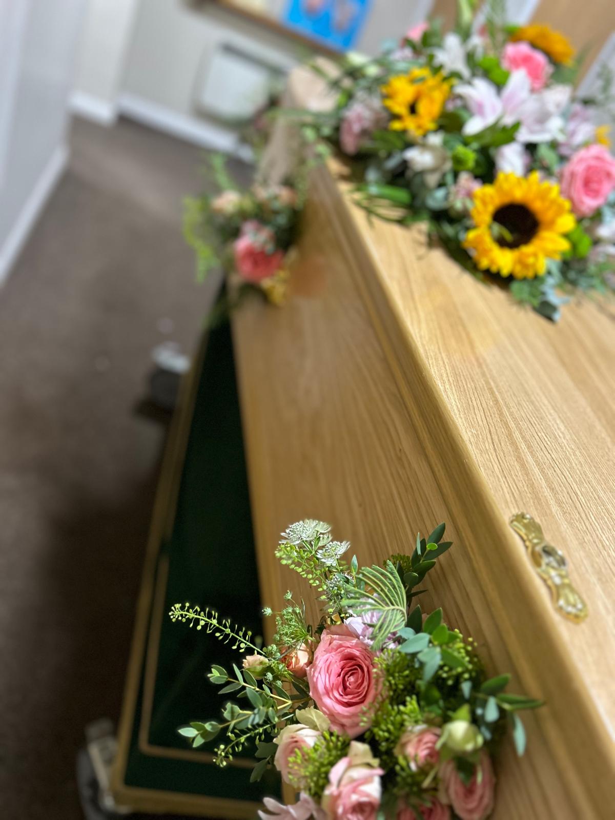 flowers on casket