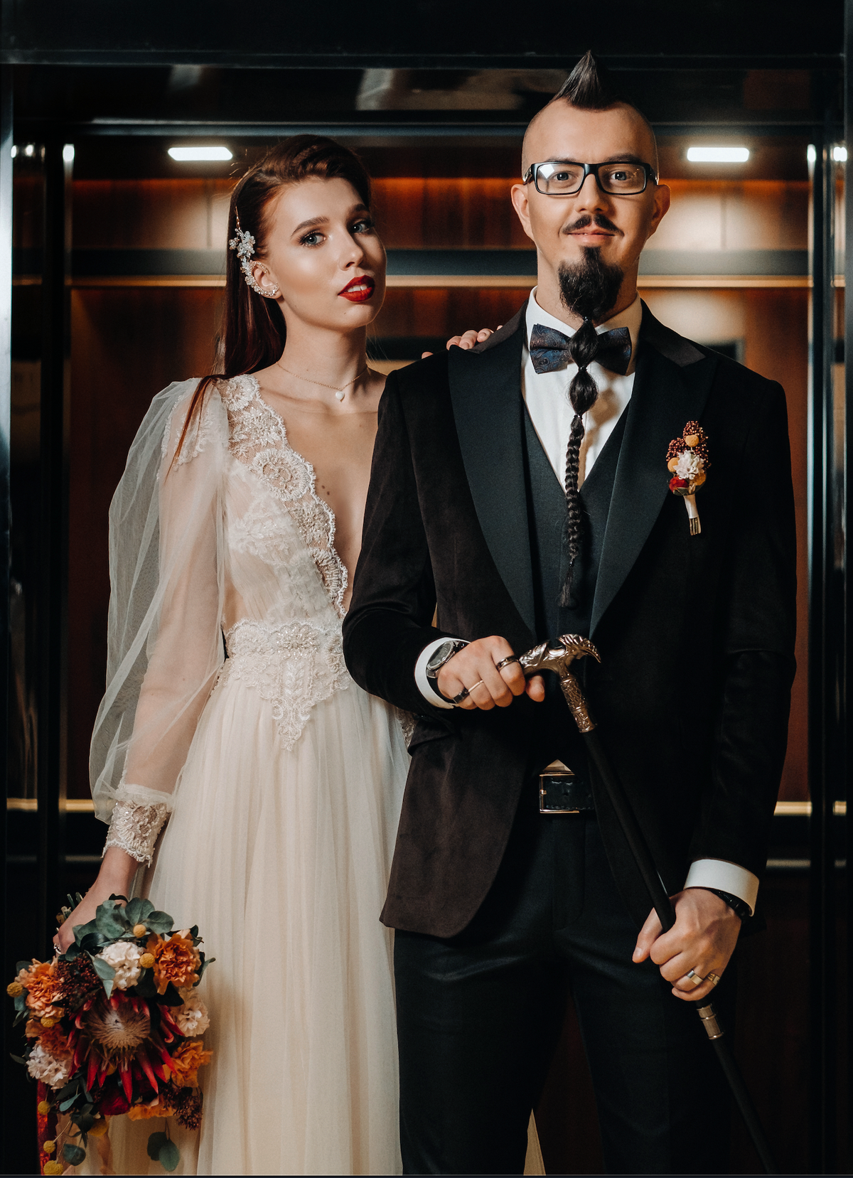 Groom lifting the bride in a joyful outdoor wedding portrait.