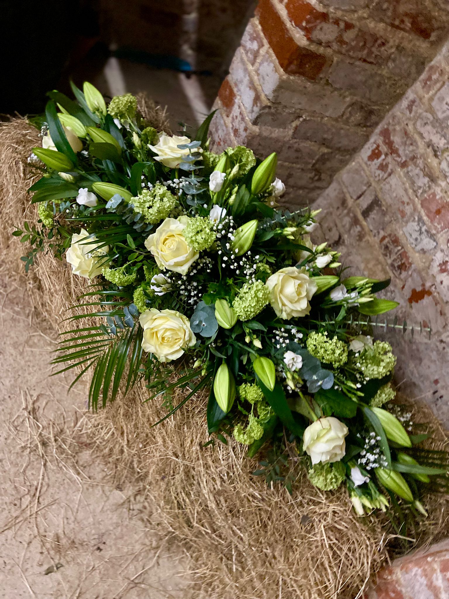 lilies and white roses funeral piece