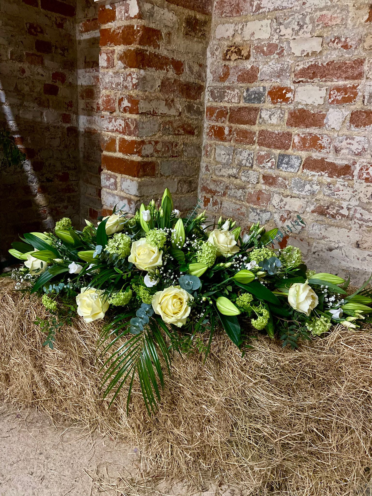 funeral flowers lilies and roses