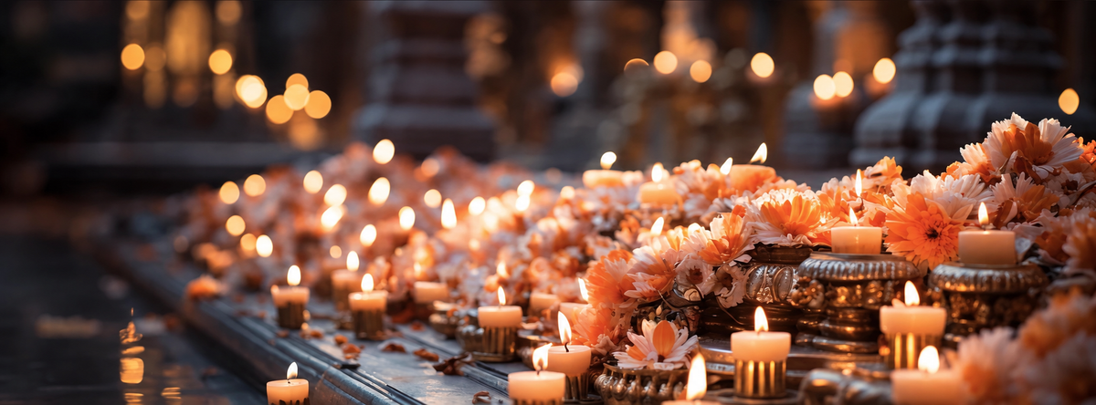 Soft peach flowers and glowing candles in a peaceful setting