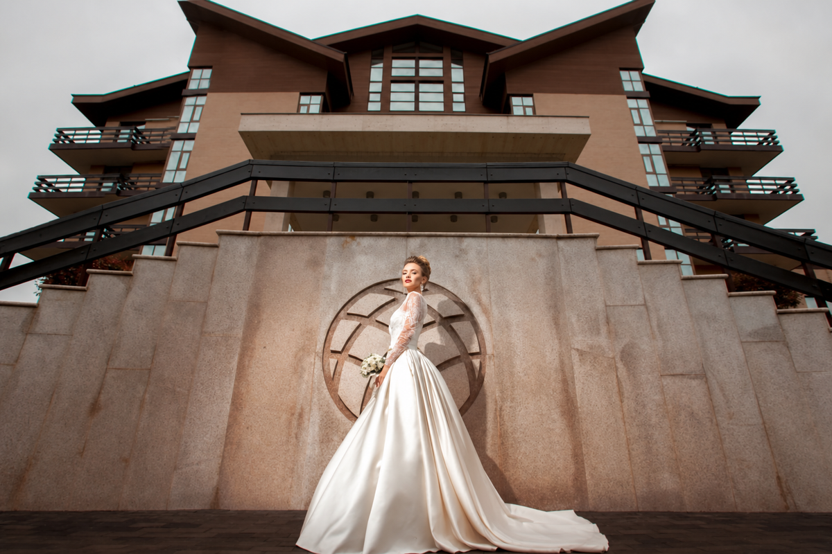 Bride holding a bouquet outside a wedding venue