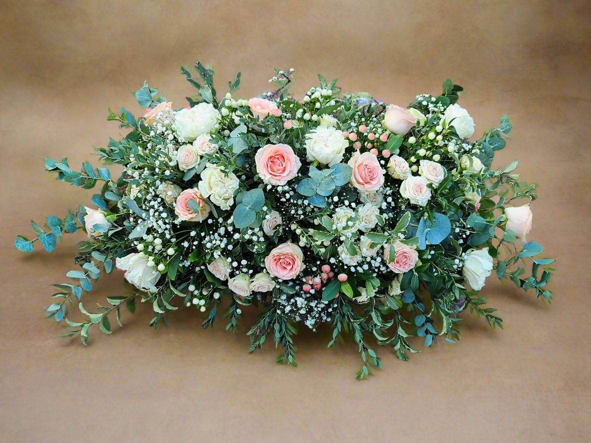 peach green and pink funeral flowers