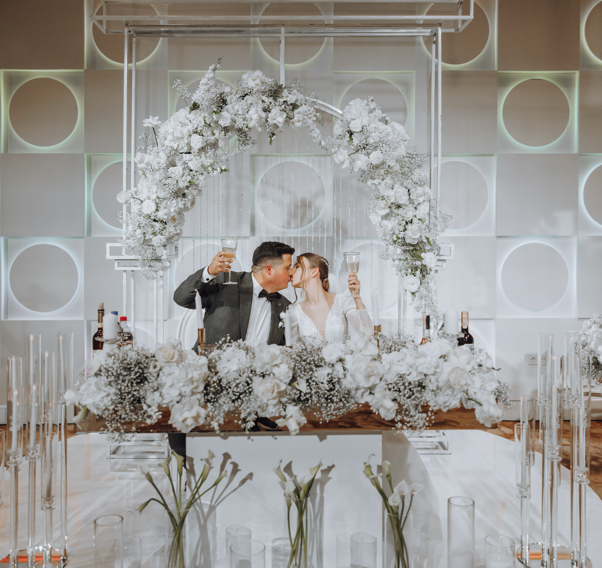 Wedding couple with soft white wedding flowers and delicate gypsophila.